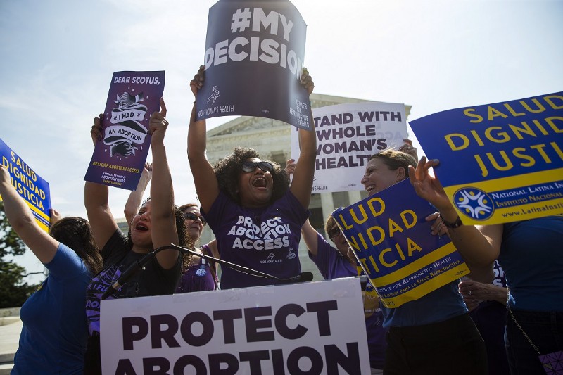 Pro-choice activists celebrate during a rally at the Supreme Court in Washington, Monday, June 27, 2016, after the court struck down Texas’ widely replicated regulation of abortion clinics
