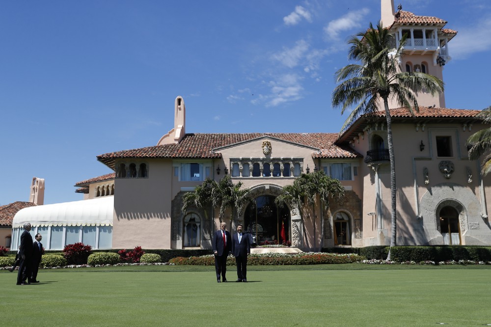 President Donald Trump and Chinese President Xi Jinping pause for photographs at Mar-a-Lago, Friday, April 7, 2017, in Palm Beach, Fla. Trump was meeting again with his Chinese counterpart Friday, with U.S. missile strikes on Syria adding weight to his threat to act unilaterally against the nuclear weapons program of China’s ally, North Korea. (AP Photo/Alex Brandon)