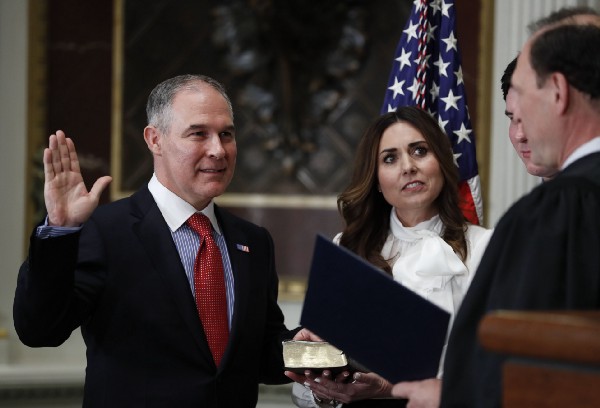 EPA Administrator Scott Pruitt, shown here at his swearing-in ceremony, contends human activity is not a primary contributor to climate change. CREDIT: AP Photo/Carolyn Kaster.