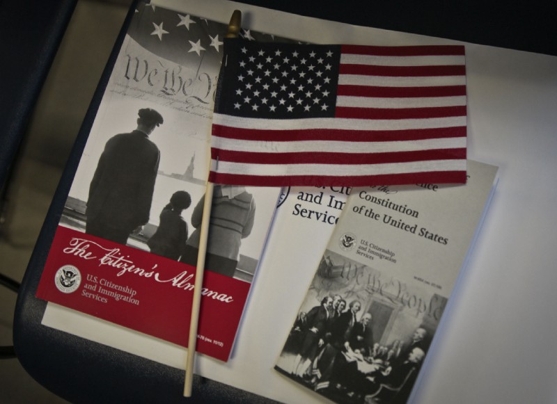 Brochures and a miniature flag awaits immigrants arriving for a naturalization ceremony at the U.S. Citizenship and Immigration Services (USCIS) on Tuesday, July 2, 2013, in New York. CREDIT: AP Photo/Bebeto Matthews