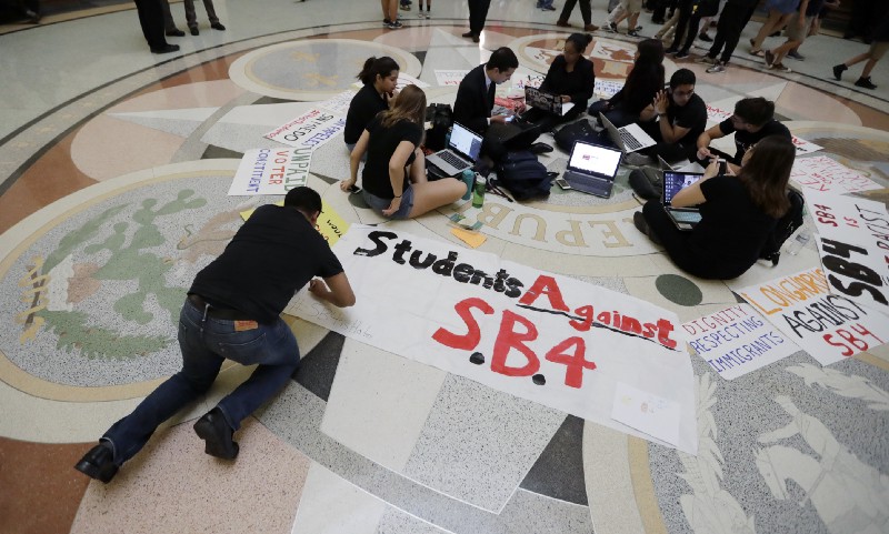 Students gather in the Rotunda at the Texas Capitol to oppose SB4, an anti-”sanctuary cities” bill. CREDIT: AP Photo/Eric Gay