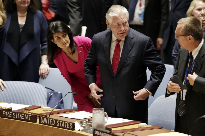 U.S. Secretary of State Rex Tillerson, center, accompanied by U.S. Ambassador Nikki Haley, left, arrives to a ministerial Security Council meeting at United Nations headquarters. CREDIT: AP Photo/Richard Drew
