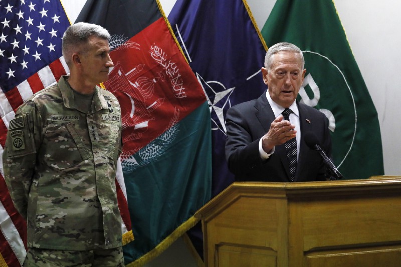 U.S. Defense Secretary James Mattis , right, and U.S. Army General John Nicholson, left, commander of U.S. Forces Afghanistan, hold a news conference at Resolute Support headquarters in Kabul, Afghanistan. CREDIT: Jonathan Ernst/Pool Photo via AP