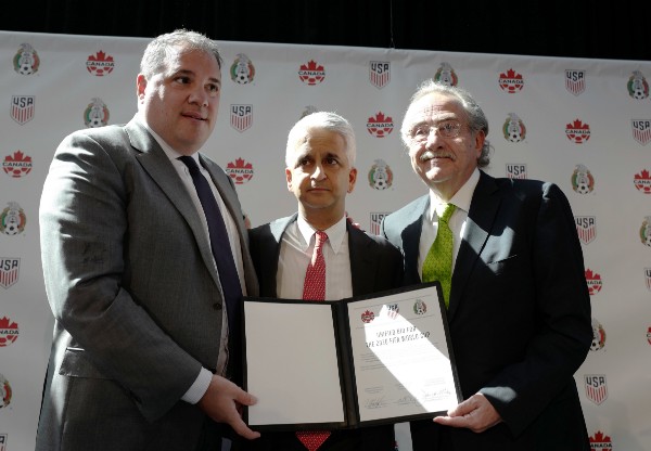 Victor Montagliani, left, President of the Canadian Soccer Association, Sunil Gulati, center, President of the United States Soccer Federation, and Decio de Maria, President of the Mexican Football Federation, show their unified bid to co-host the 2026 World Cup, Monday, April 10, 2017, in New York. CREDIT: AP Photo/Mark Lennihan
