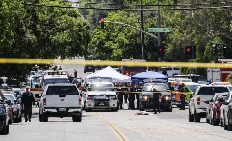 Police gather outside North Park Elementary School in San Bernardino, Califorina. (Credit: AP Photo)