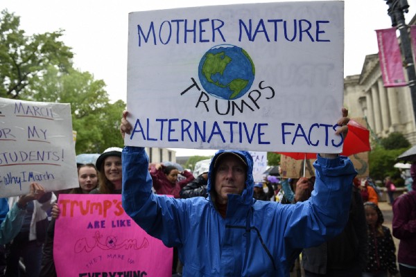 Marcher targets Trump administration’s aversion to the truth at the March for Science in Washington on April 22, 2017. CREDIT: AP Photo/Sait Serkan Gurbuz