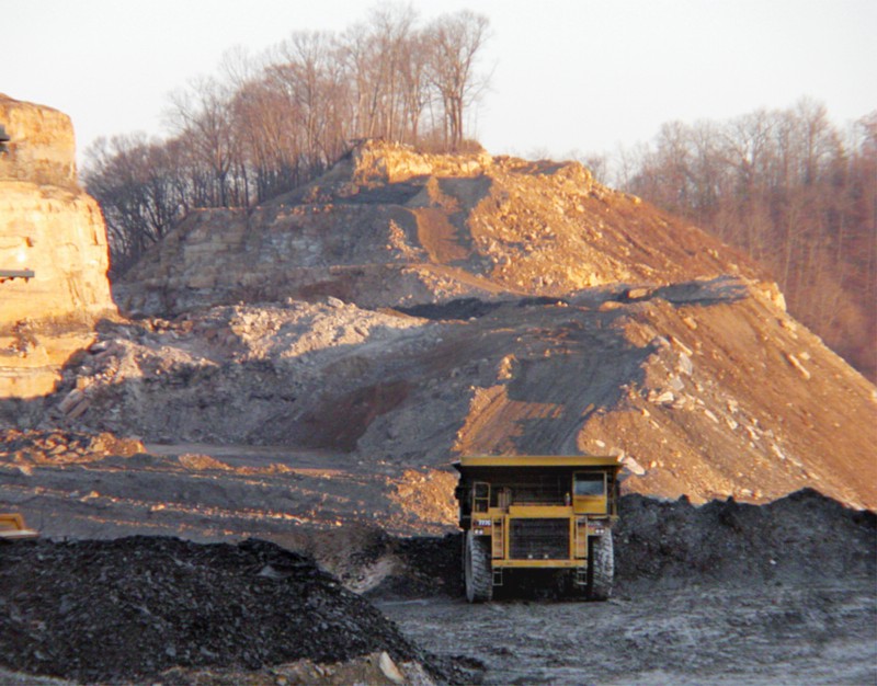 A dump truck moves dirt and rock from a mountaintop removal coal mine in Kentucky. CREDIT: AP Photo/Roger Alford