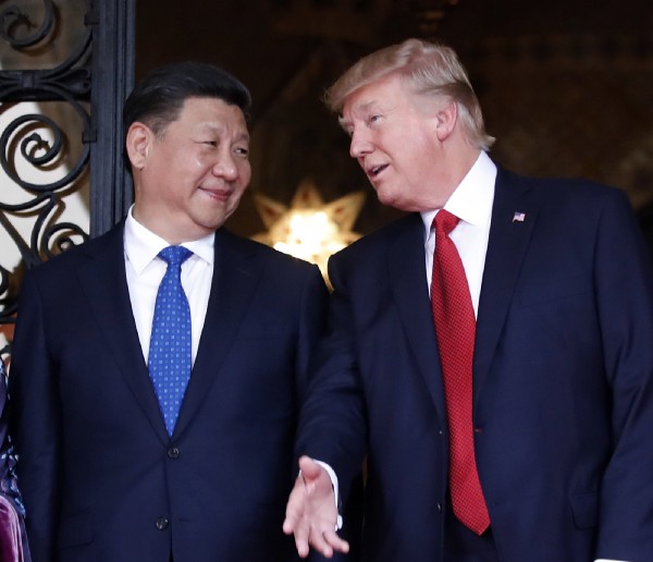 LEFT: President Barack Obama, right, and Chinese President Xi Jinping, center; How Hwee Young/Pool Photo via AP RIGHT: Xi Jinping and President Donald Trump; AP Photo/Alex Brandon, File