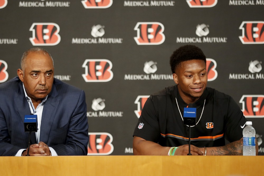 Cincinnati Bengals second-round draft pick Joe Mixon, right, is interviewed alongside head coach Marvin Lewis, left, during a news conference at Paul Brown Stadium, Saturday, April 29, 2017, in Cincinnati. CREDIT: AP Photo/John Minchillo