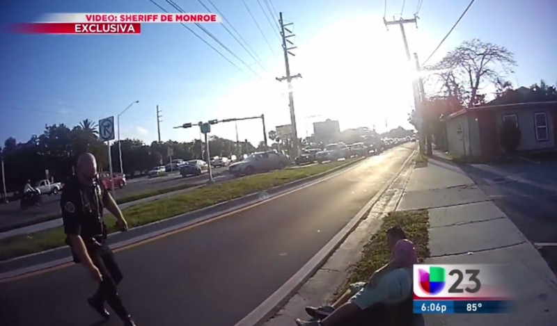 Marcos Antonio Huete (right) lays on the sidewalk after being hit by a car. CREDIT: Screengrab