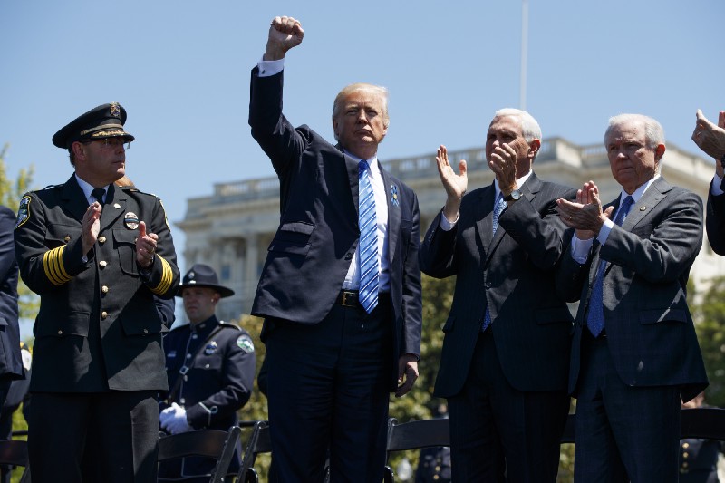 Attorney General Jeff Sessions, right, and President Donald Trump have pledged a return to old hardline law enforcement practices — but not for white-collar crime. CREDIT: AP Photo/Evan Vucci