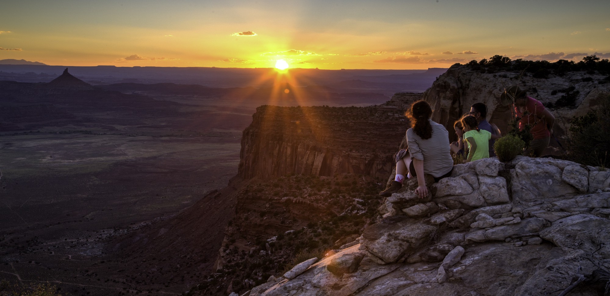 A family watches the sun set over Indian Creek in the newly minted — and already threatened — Bears Ears National Monument. CREDIT: Bureau of Land Management/Flickr