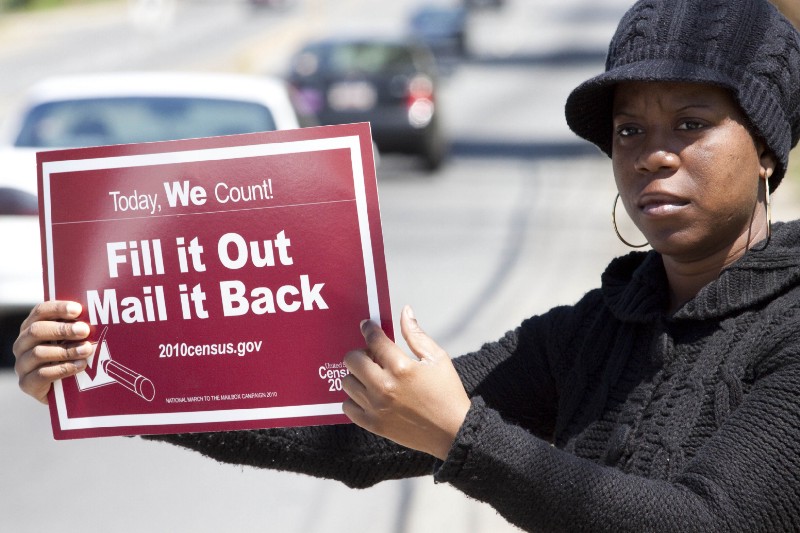 A volunteer advertising the 2010 Census. CREDIT: AP Photo/Jason E. Miczek
