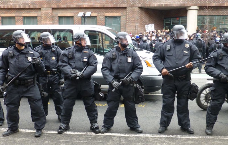 Police stand guard as more than two hundred people are corralled in downtown Washington, D.C. on the day of Donald Trump’s inauguration. CREDIT: ThinkProgress/Mark Hand