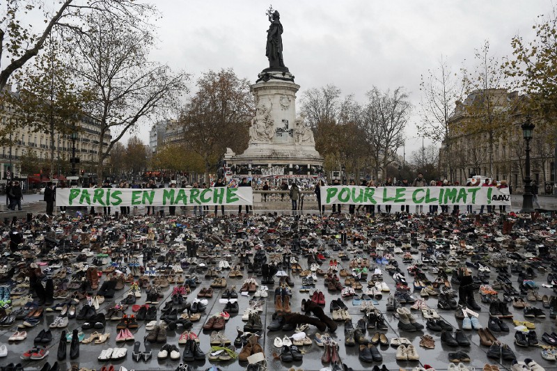 Hundreds of pairs of shoes are displayed at the place de la Republique, in Paris, as part of a symbolic and peaceful rally on November 29, 2015. CREDIT: AP Photo/Laurent Cipriani