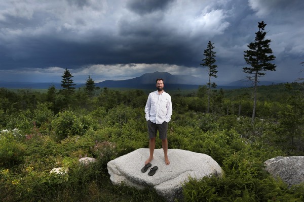 Lucas St. Clair, son of Burt’s Bees founder Roxanne Quimby, stands on land at the Katahdin Woods and Waters National Monument in Maine. CREDIT: AP Photo/Robert F. Bukaty