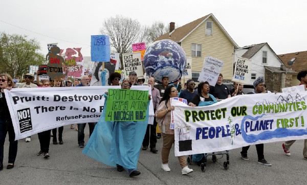Residents of East Chicago rally near a public-housing complex, where roughly 1,000 people were ordered evacuated because of lead contamination. CREDIT: AP Photo/Teresa Crawford