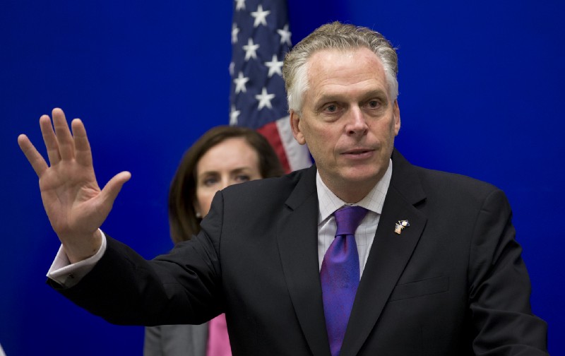 With federal efforts to limit carbon emissions on hold, Virginia Gov. Terry McAuliffe opts to begin a regulatory process to reduce power plant emissions in his state. CREDIT: AP Photo/Steve Helber