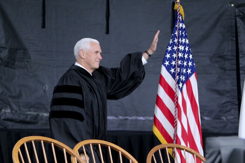 Vice President Michael Pence waves as he arrives at the commencement ceremony at Grove City College on Saturday, May 20, 2017. CREDIT: AP Photo/Keith Srakocic