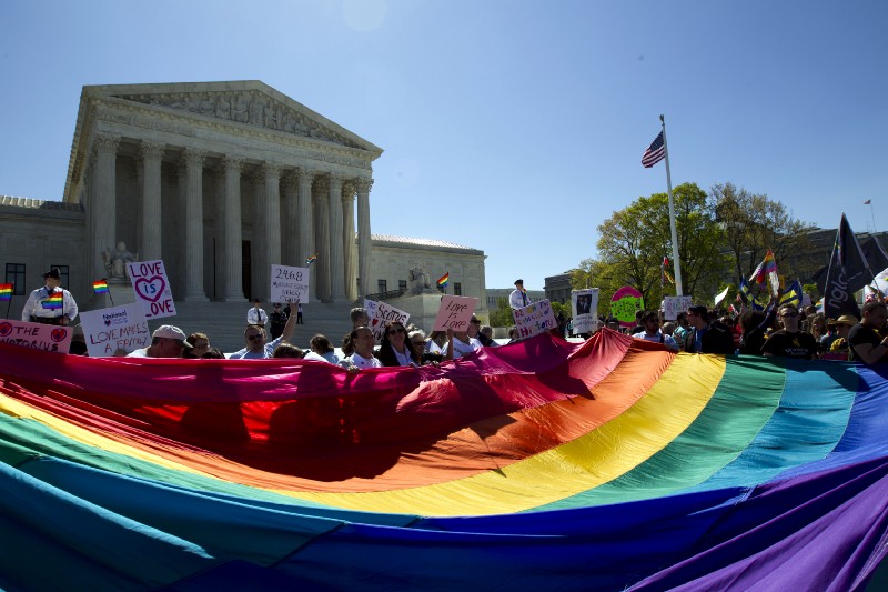 Supporters of marriage equality rallying outside the Supreme Court in April of 2015. CREDIT: AP Photo/Jose Luis Magana