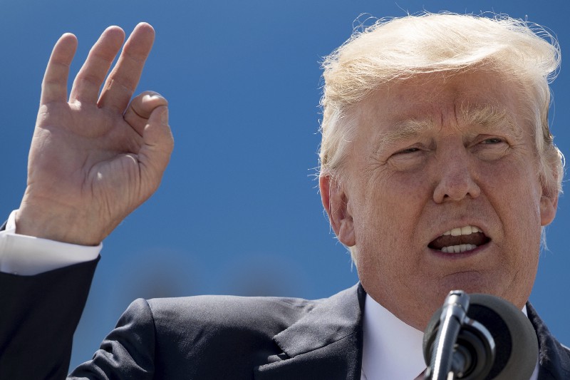 President Donald Trump speaks about healthcare in front of Air Force One, Tuesday, June 13, 2017, at General Mitchell International Airport in Milwaukee, Wis. CREDIT: AP Photo/Andrew Harnik