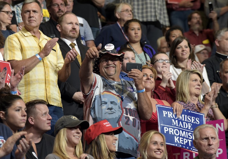 President Donald Trump told a crowd at the U.S. Cellular Center in Cedar Rapids, Iowa, on June 21, 2017, that he kept his promise to withdraw from the Paris climate agreement. CREDIT: AP Photo/Susan Walsh