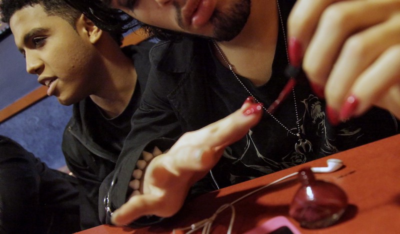Baresco Escobar, 19, left, from Fairfax, Va., an aspiring entertainer who identifies himself as bisexual, sits next to his friend applying nail polish while visiting a local fast food hangout, March 1, 2012, in New York. CREDIT: AP/Bebeto Matthews