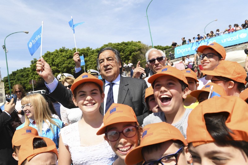 Italian Coastguard, children, volunteers and officials take part in a symbolic rescue of paper boats to send a message to the G7 leaders to take action to safeguard children on the move off a beach in Palermo, Italy, on May 25, 2017. CREDIT: Salvatore Cavalli/AP Images for UNICEF