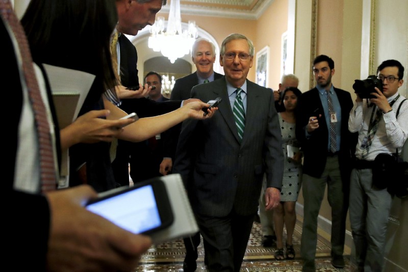 Senate Majority Leader Mitch McConnell of Ky., center, followed by Majority Whip John Cornyn, R-Texas, leaves a Republican meeting on healthcare. CREDIT: AP Photo/Jacquelyn Martin