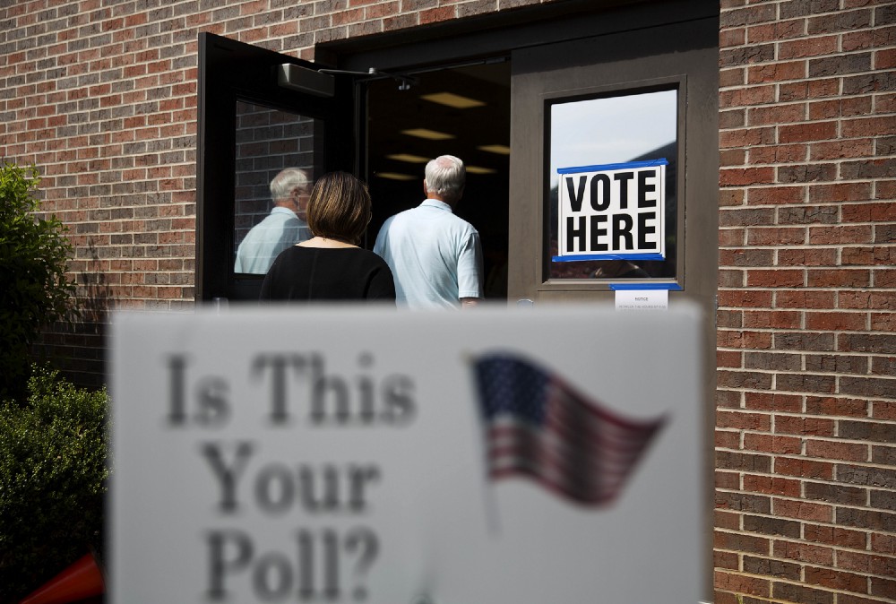 Voters enter a polling site to cast ballots in a special election in Marietta, Ga., Tuesday, April 18, 2017. CREDIT: AP Photo/David Goldman