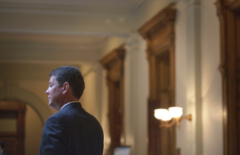 Secretary of State Brian Kemp leaves a press conference Sept. 29, 2011 in Atlanta. CREDIT: AP Photo/David Goldman