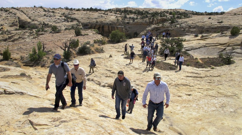 Utah state legislators lead the way for Interior Secretary Ryan Zinke, in the distance, on walk through Bears Ears National Monument on May 8, 2017. CREDIT: AP Photo/Michelle Price
