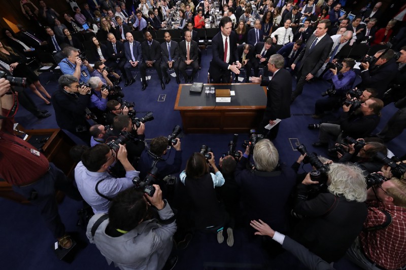 Former FBI director James Comey is greeted by Senate Intelligence Committee Chairman Richard Burr (R-NC) at the beginning of the Senate Intelligence Committee hearing on June 8. CREDIT: AP Photo/Alex Brandon