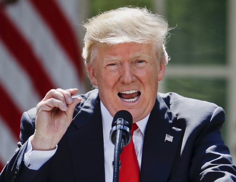 President Donald Trump gestures while speaking about the U.S. role in the Paris climate change accord, Thursday, June 1, 2017, in the Rose Garden of the White House in Washington. CREDIT: AP/Pablo Martinez Monsivais