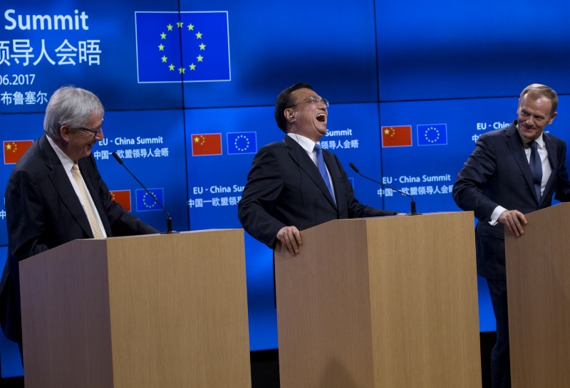 Chinese Premier Li Keqiang, center, with European Council President Donald Tusk, right, and European Commission President Jean-Claude Juncker at the EU-China summit in Brussels, June 2, 2017. CREDIT: AP Photo/Virginia Mayo