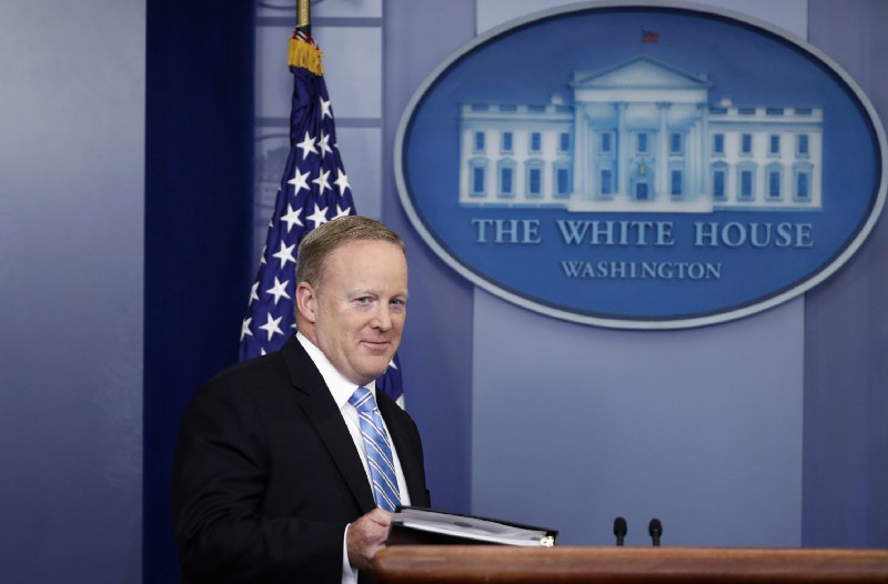 White House press secretary Sean Spicer arrives for the daily news briefing at the White House on Monday. CREDIT: AP Photo/Alex Brandon