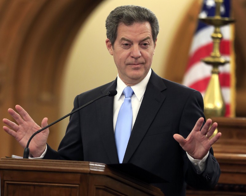 Kansas Gov. Sam Brownback speaks to the legislature in Topeka, Kansas, Jan. 12, 2016. CREDIT: AP/Orlin Wagner