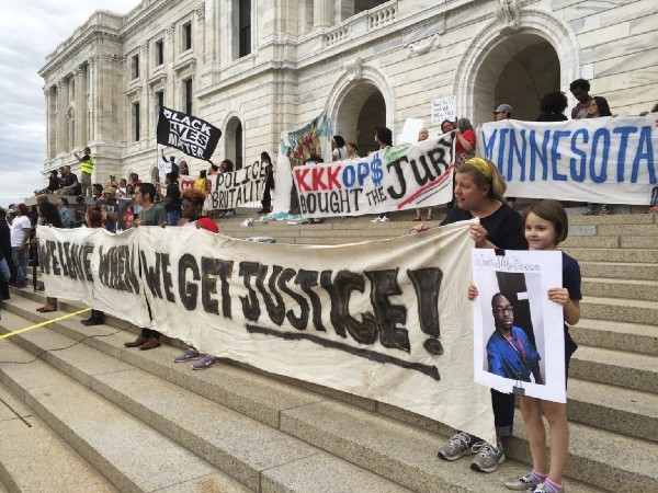 Protesters gather outside the state Capitol in St. Paul, Minn., Friday, June 16, 2017, after St. Anthony police Officer Jeronimo Yanez was cleared in the fatal shooting of Philando Castile. CREDIT: AP Photo/Steve Karnowski