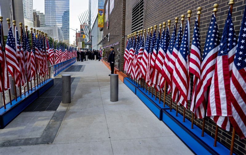 An FDNY firefighter stands as part of an honor guard at the FDNY Memorial Wall near the World Trade Center on Sunday, Sept. 11, 2016, on the 15th anniversary of the attacks on the World Trade Center in New York. CREDIT: AP Photo/Craig Ruttle
