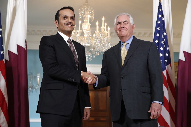 Secretary of State Rex Tillerson, right, shakes hands with Qatari Foreign Minister Sheikh Mohammed bin Abdulrahman bin Jassim Al Thani, May 8, 2017, at the State Department in Washington. CREDIT: AP Photo/Jacquelyn Martin