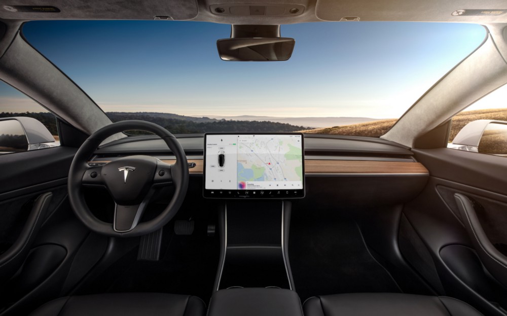 The unexpectedly sleek and button-free dashboard of Tesla’s Model 3. CREDIT: Tesla.