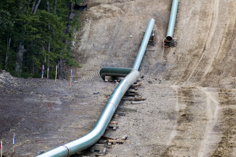 Segments of assembled pipe are lined up along a cleared section of woods on July 8, 2017, where a natural gas pipeline is under construction in Butler County, Pennsylvania. CREDIT: AP Photo/Keith Srakocic
