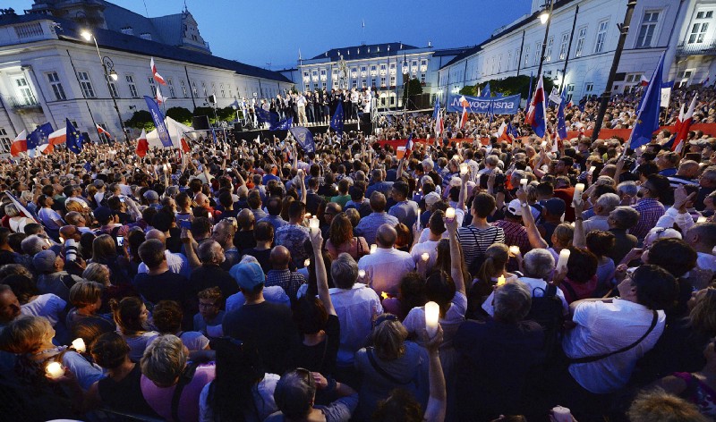 Opposition supporters protest in front of the presidential palace, urging President Andrzej Duda to reject a bill voted by lawmakers on court control, in Warsaw, Poland, Thursday, July 20, 2017. CREDIT: AP Photo/Czarek Sokolowski