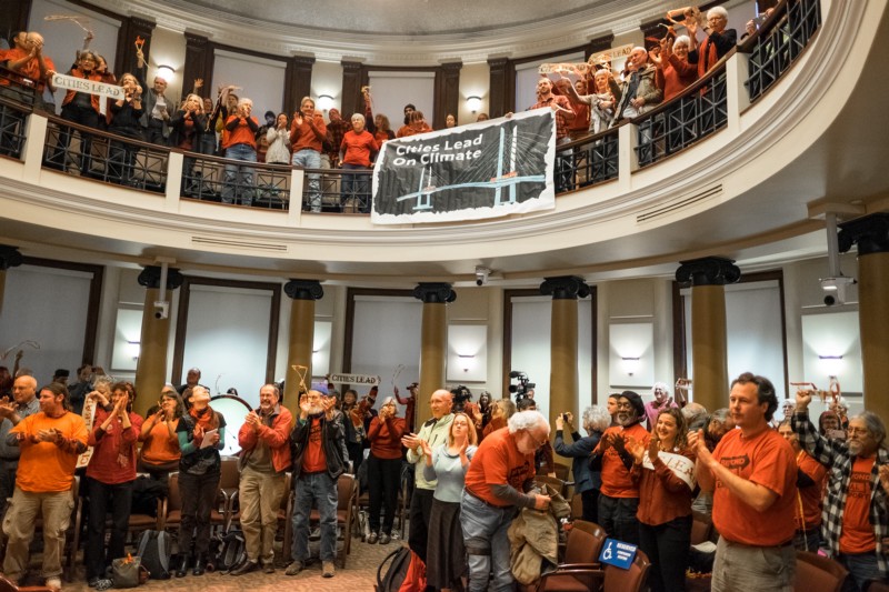 Supporters of Portland’s fossil fuel infrastructure ban celebrate after the City Council vote in 2016. CREDIT: 350PDX