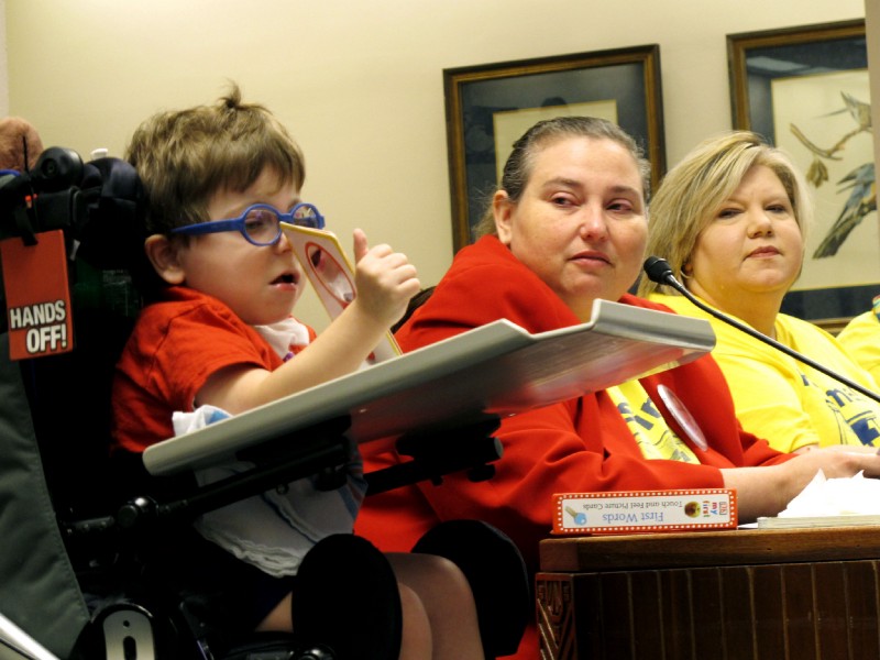 In 2016, Angela Lorio talks about the services the state provides for her son John Paul at a Louisiana Senate Finance Committee hearing. CREDIT: AP Images/ Melinda Deslatte