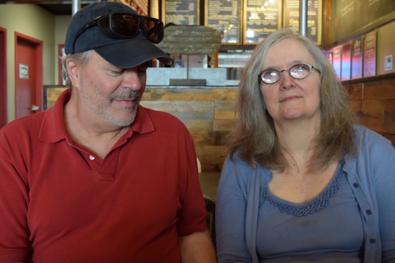 Jim Cooke administers his wife Susan Mooring’s eye drops. He’s been her rock since she’s began losing her vision in 2013. Credit: Amanda Gomez/ThinkProgress