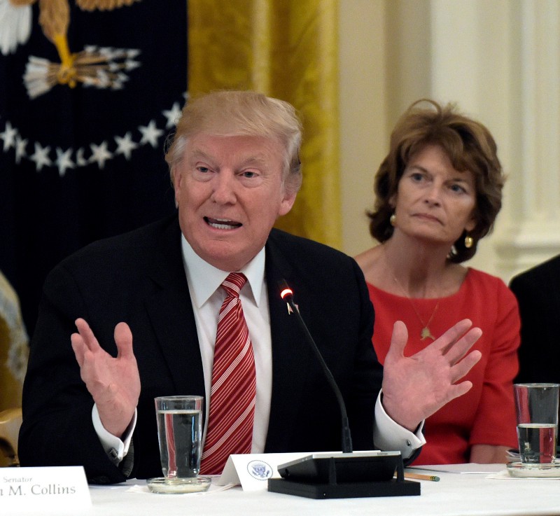 President Donald Trump meets with Republican senators, including Sen. Lisa Murkowski (R-AK), on health care at the White House on June 27, 2017. CREDIT: AP Photo/Susan Walsh