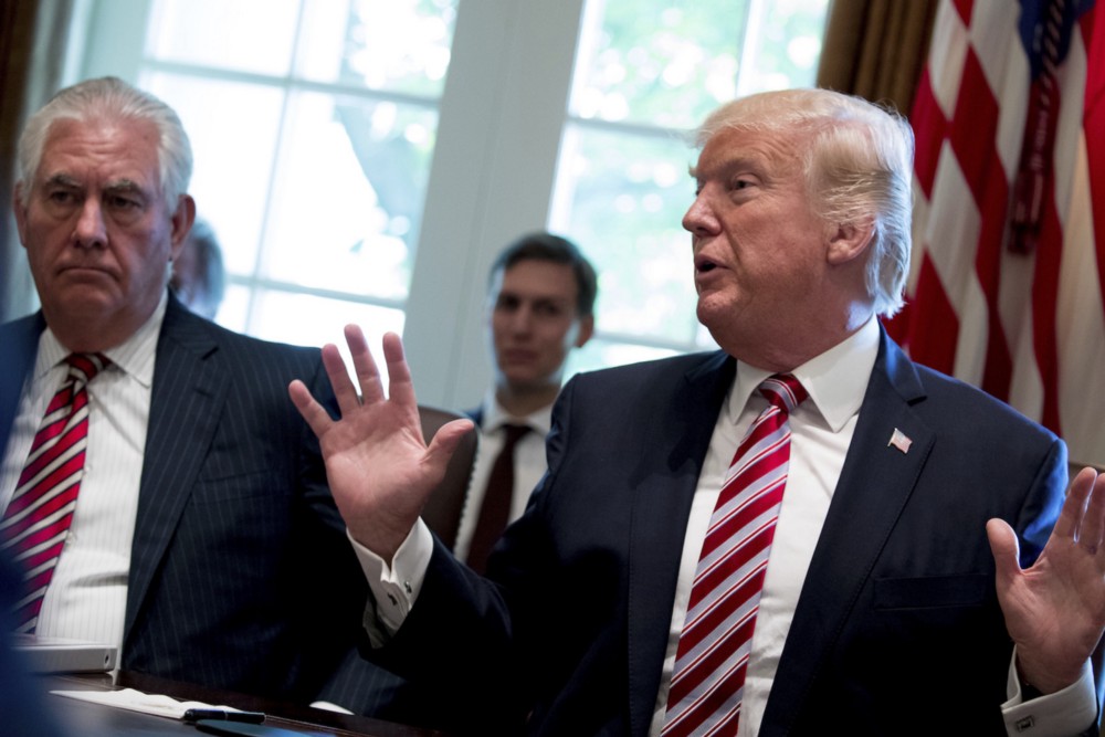Secretary of State Rex Tillerson and President Donald Trump at the White House June 2017. CREDIT: AP/Andrew Harnik