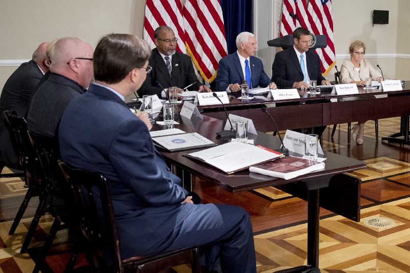 Vice President Mike Pence gavels in for the first meeting of the Presidential Advisory Commission on Election Integrity at the Eisenhower Executive Office Building in Washington, Wednesday, July 19, 2017. CREDIT: AP Photo/Andrew Harnik