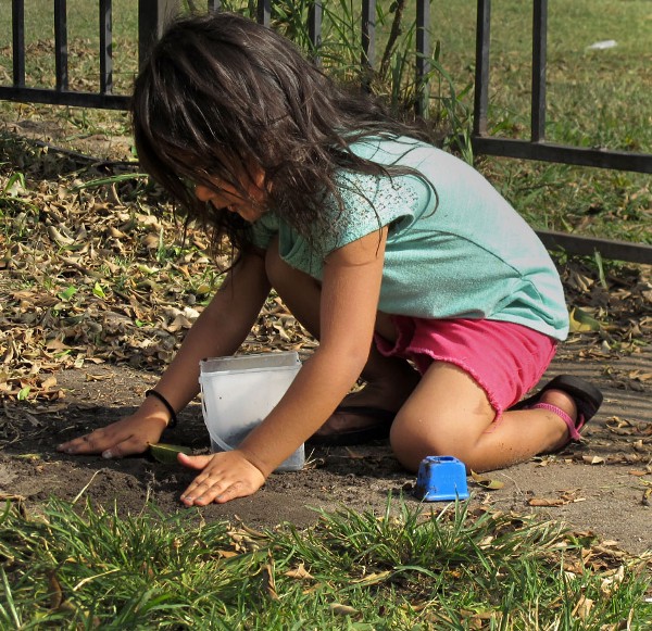 Typical child-play stirs up dirt and dust that can lead to inhalation of soil lead particles. CREDIT: Yvette Cabrera/ThinkProgress